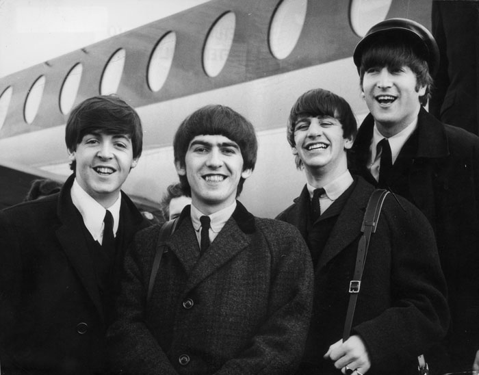 Beatles descendo do avião